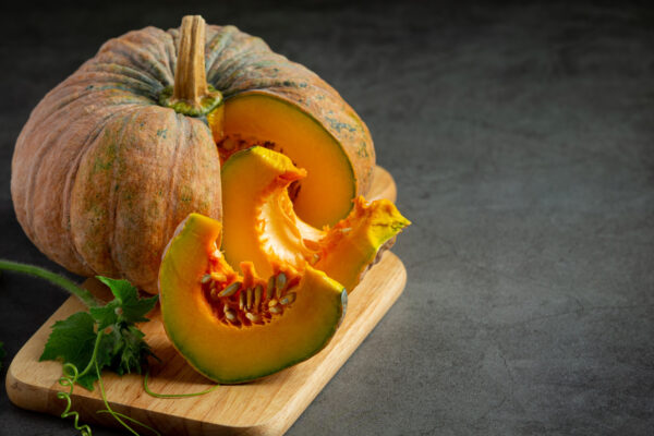 chopped-raw-pumpkin-put-wooden-cutting-board